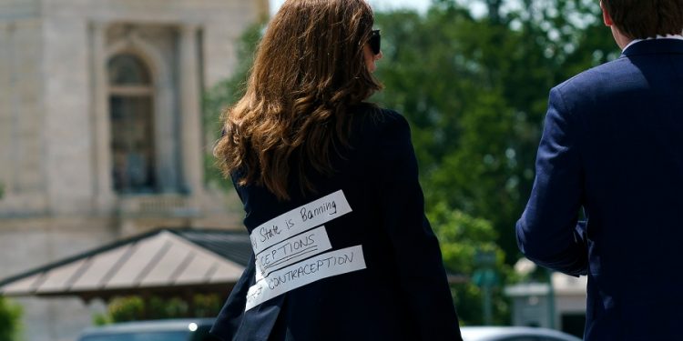 Mace wears jacket supporting contraception access