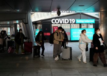 WHO urges China to release more information about new COVID infections