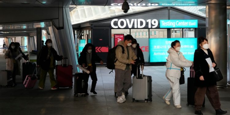 WHO urges China to release more information about new COVID infections