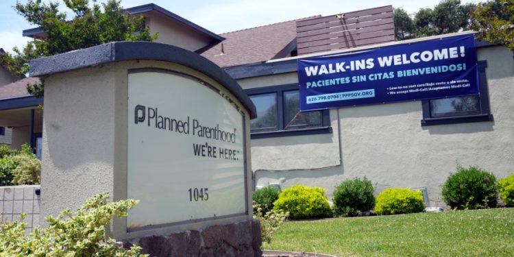 Planned Parenthood to cut staff at national level in strategy shift