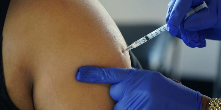 COVID summer surge: Should you get a booster now or wait?