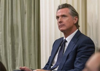 Newsom signs bill raising minimum wage for California health care workers to $25