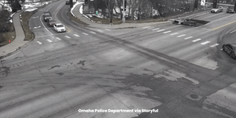 WATCH: Two cars fall into sinkhole at traffic light in Nebraska