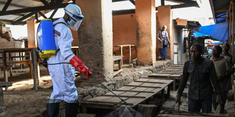 American doctor battling Ebola is weak but stable, officials say